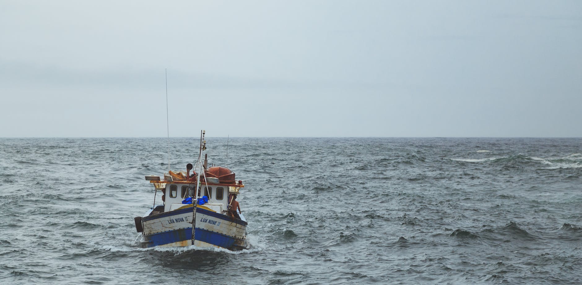 Deep-sea sportfishing boat heading offshore off the Miami coast