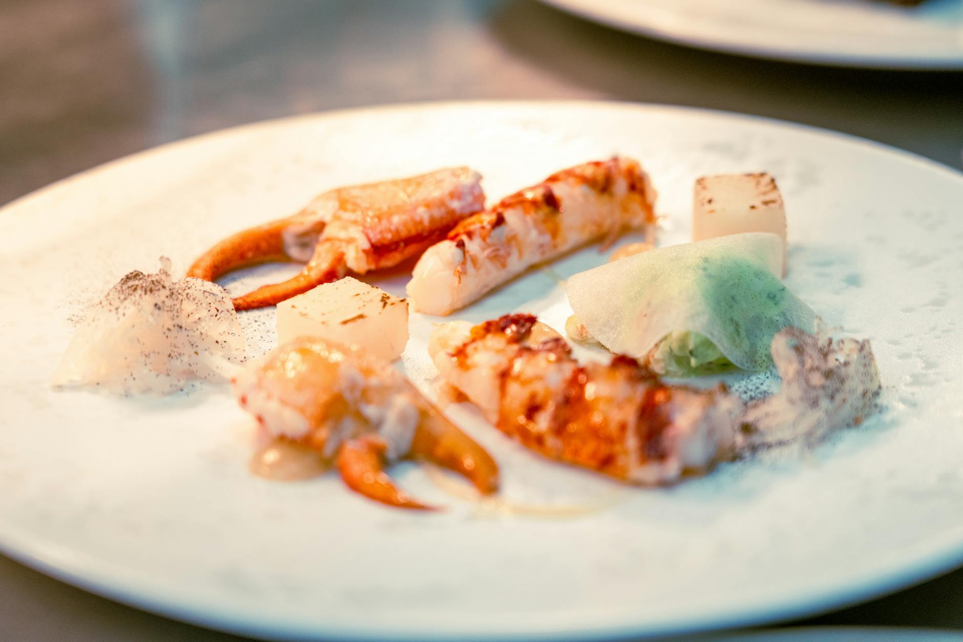 Multi-course tasting menu plated at a Miami restaurant