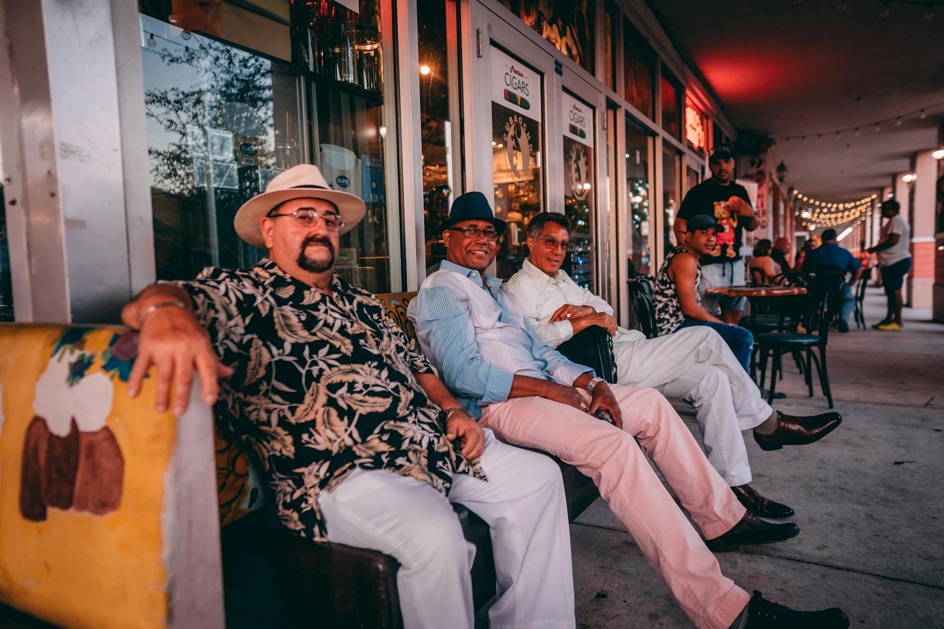 Men enjoying Cuban coffee and conversation at an outdoor cafe in Little Havana Miami