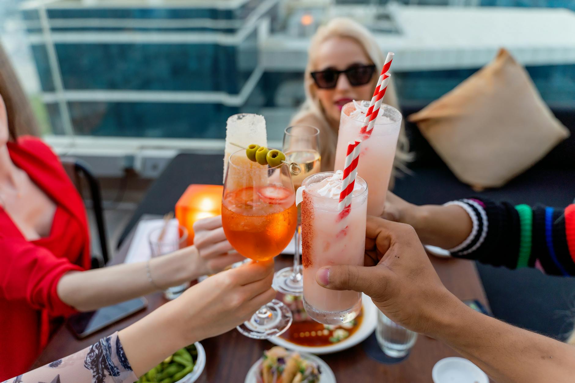 Friends having drinks at a downtown Miami rooftop bar