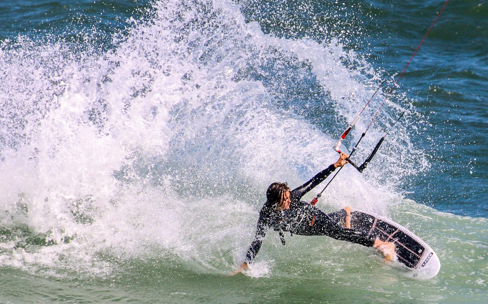 Wakeboarder carving Miami's flat bay water at speed
