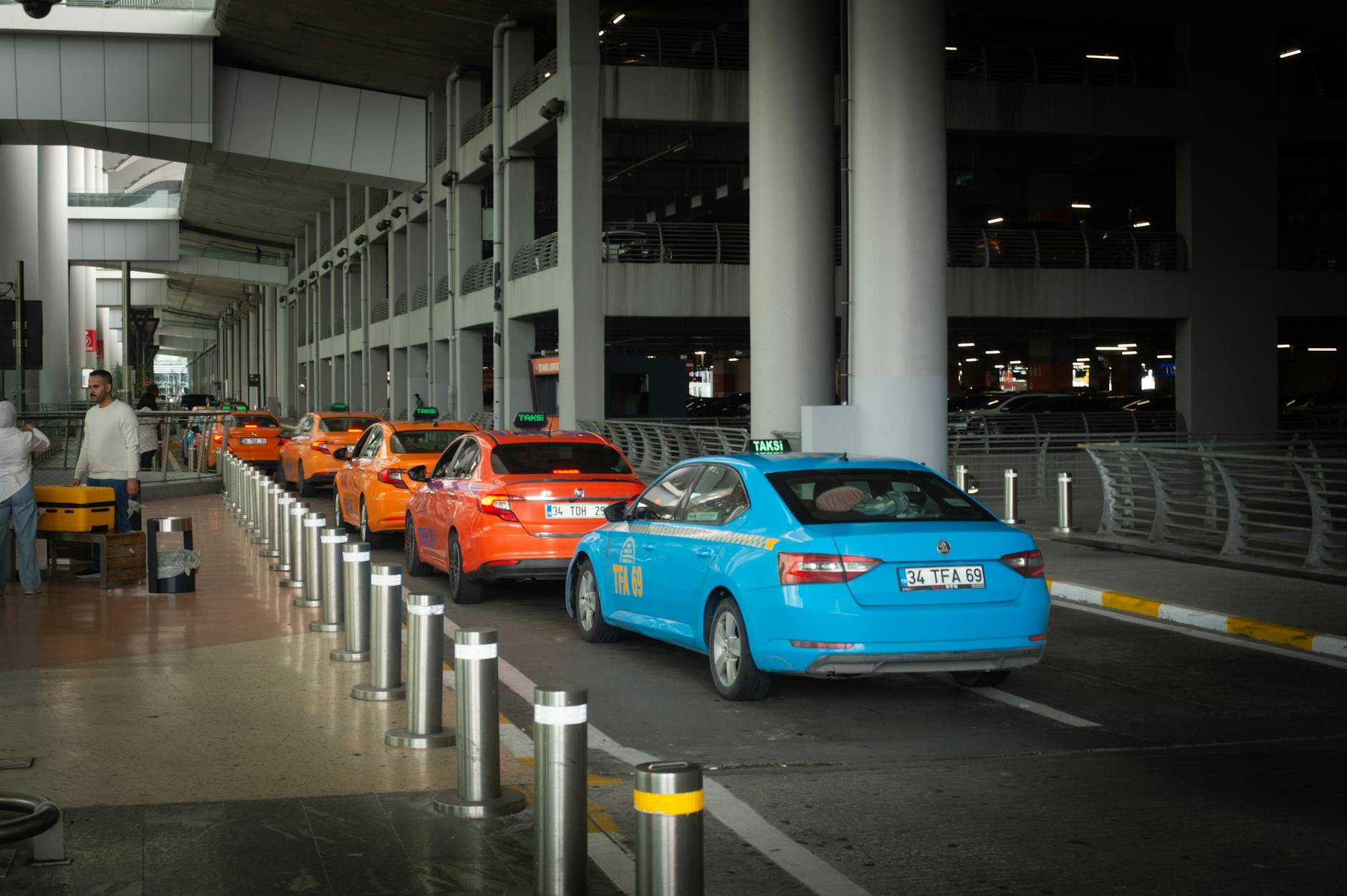 Taxis lined up at the arrivals curb outside Miami International Airport