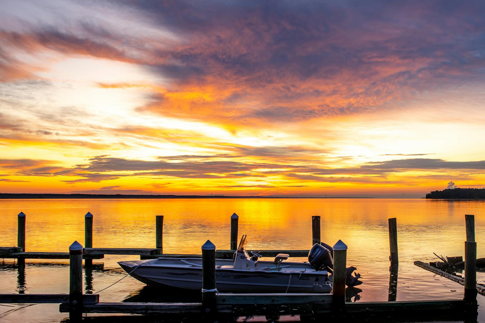 A boat on the calm water of Biscayne National Park at sunset