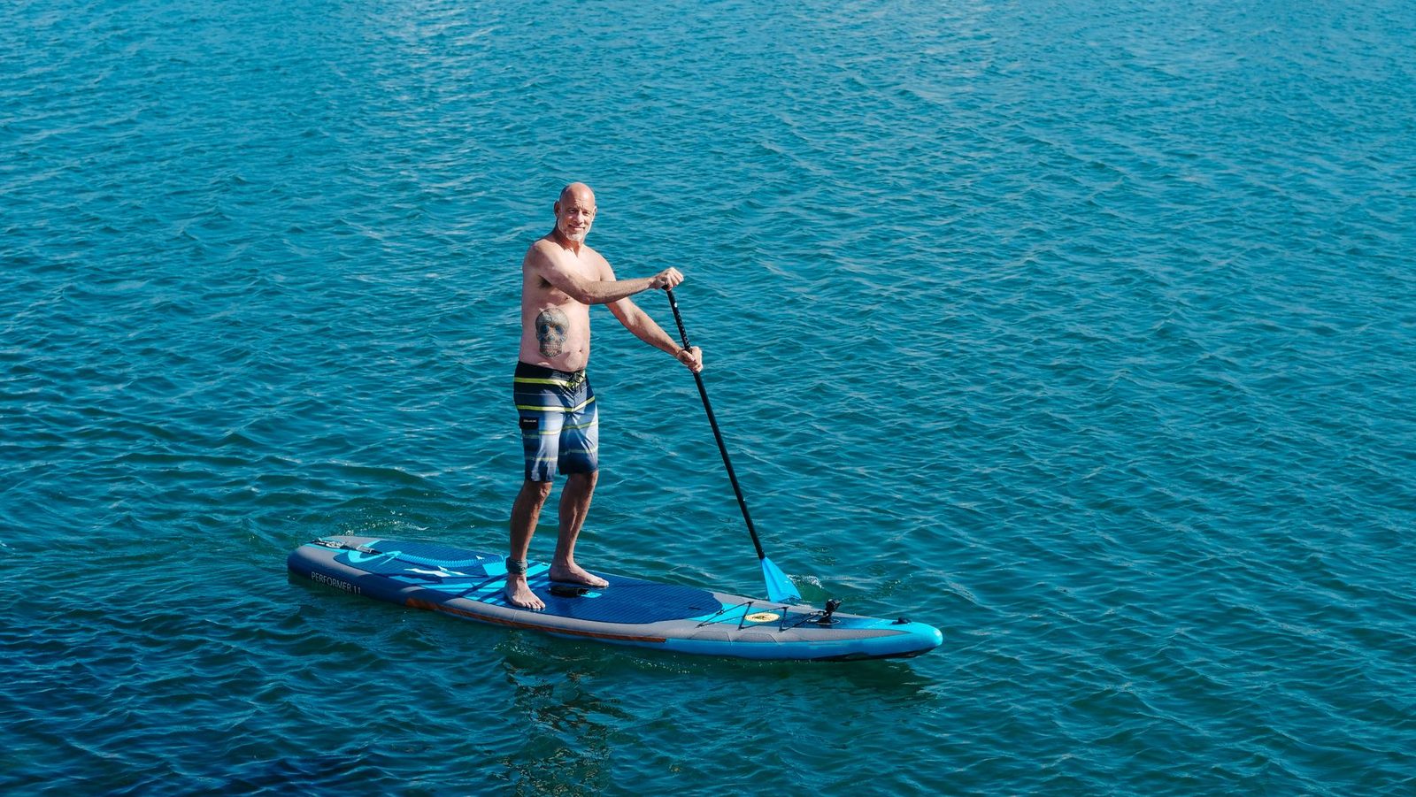 paddleboarding on turquoise coastal water