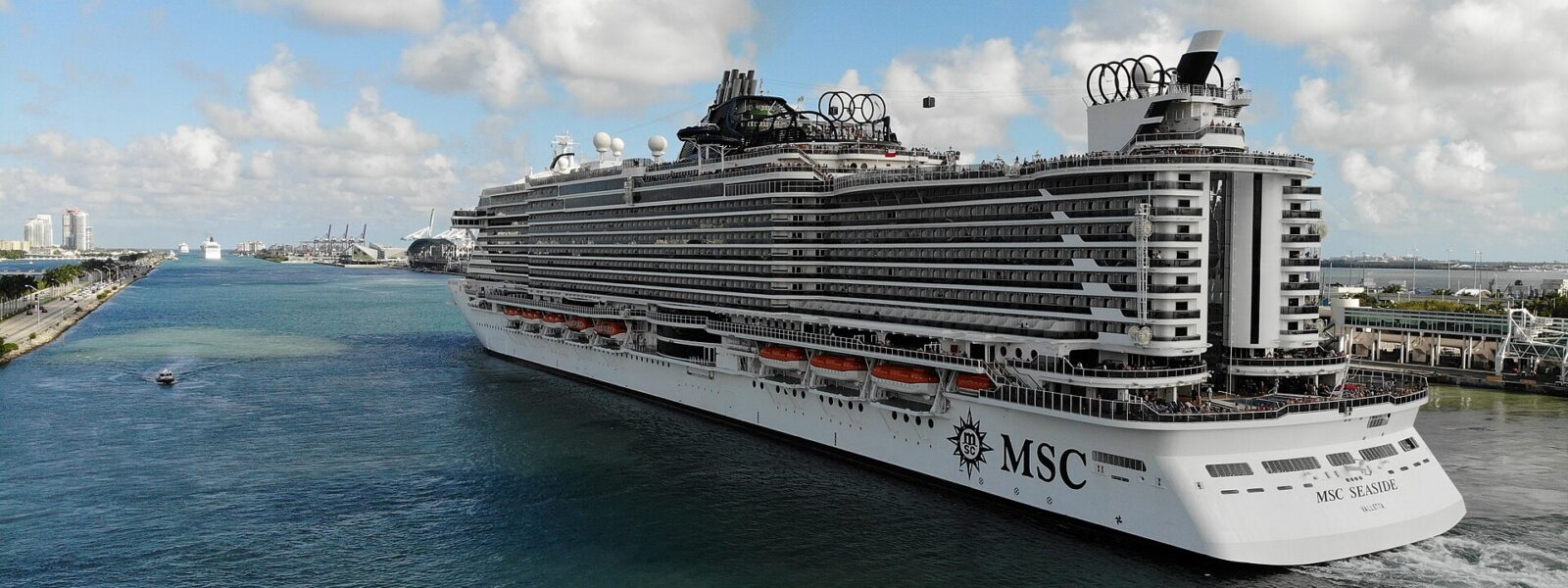 MSC Seaside sailing outbound through Government Cut past the PortMiami cranes