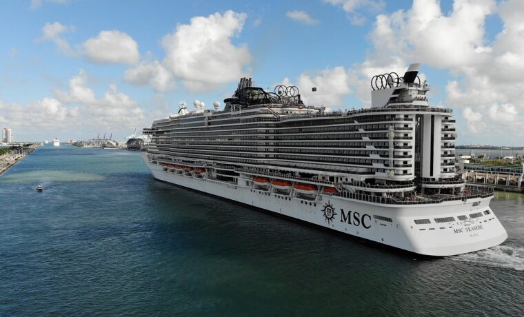 MSC Seaside sailing outbound through Government Cut past the PortMiami cranes