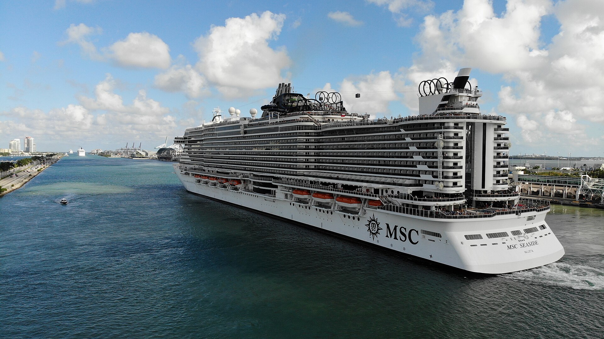 MSC Seaside sailing outbound through Government Cut past the PortMiami cranes