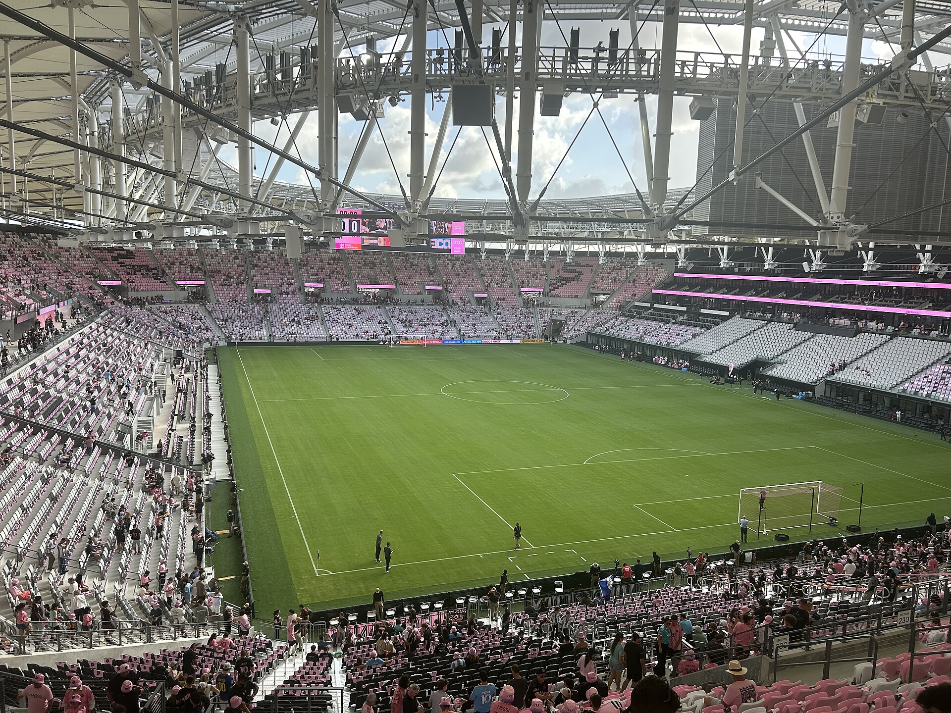 The view of the Nu Stadium pitch from the upper level near section 230, under the white roof trusses and scoreboard
